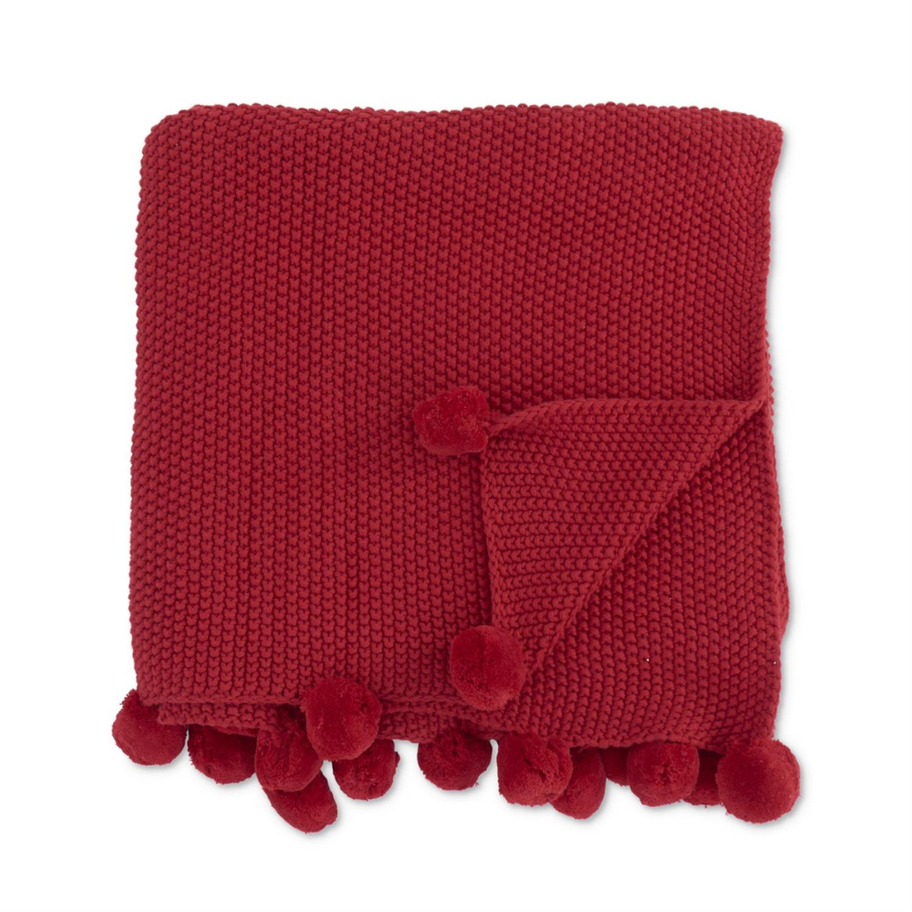 FRAZADA TEJIDA EN TONO ROJO CON POMPONES MED:150 CM